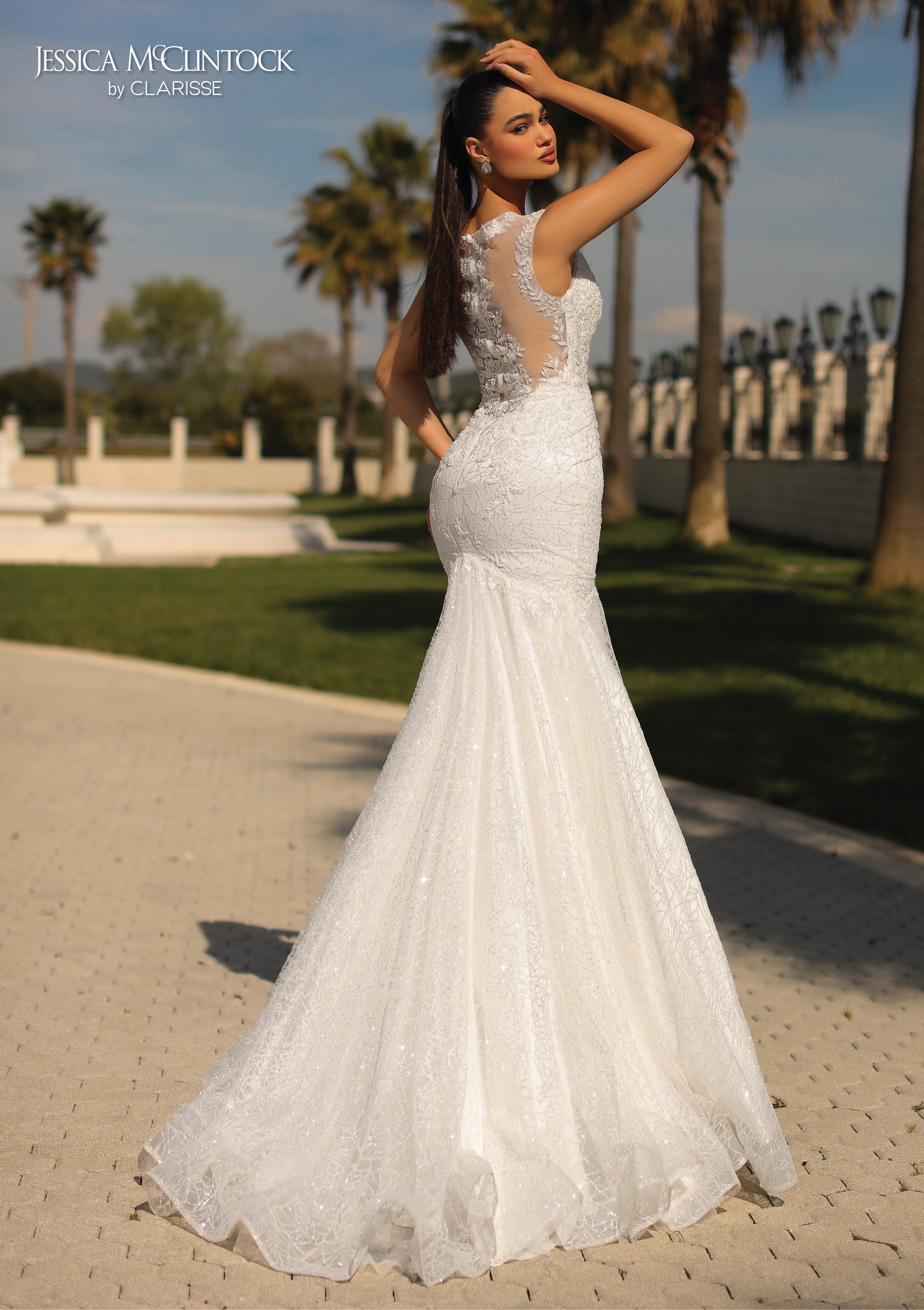 Stunning White Wedding Dress with a Sheer back featuring lace applique and mermaid train. 