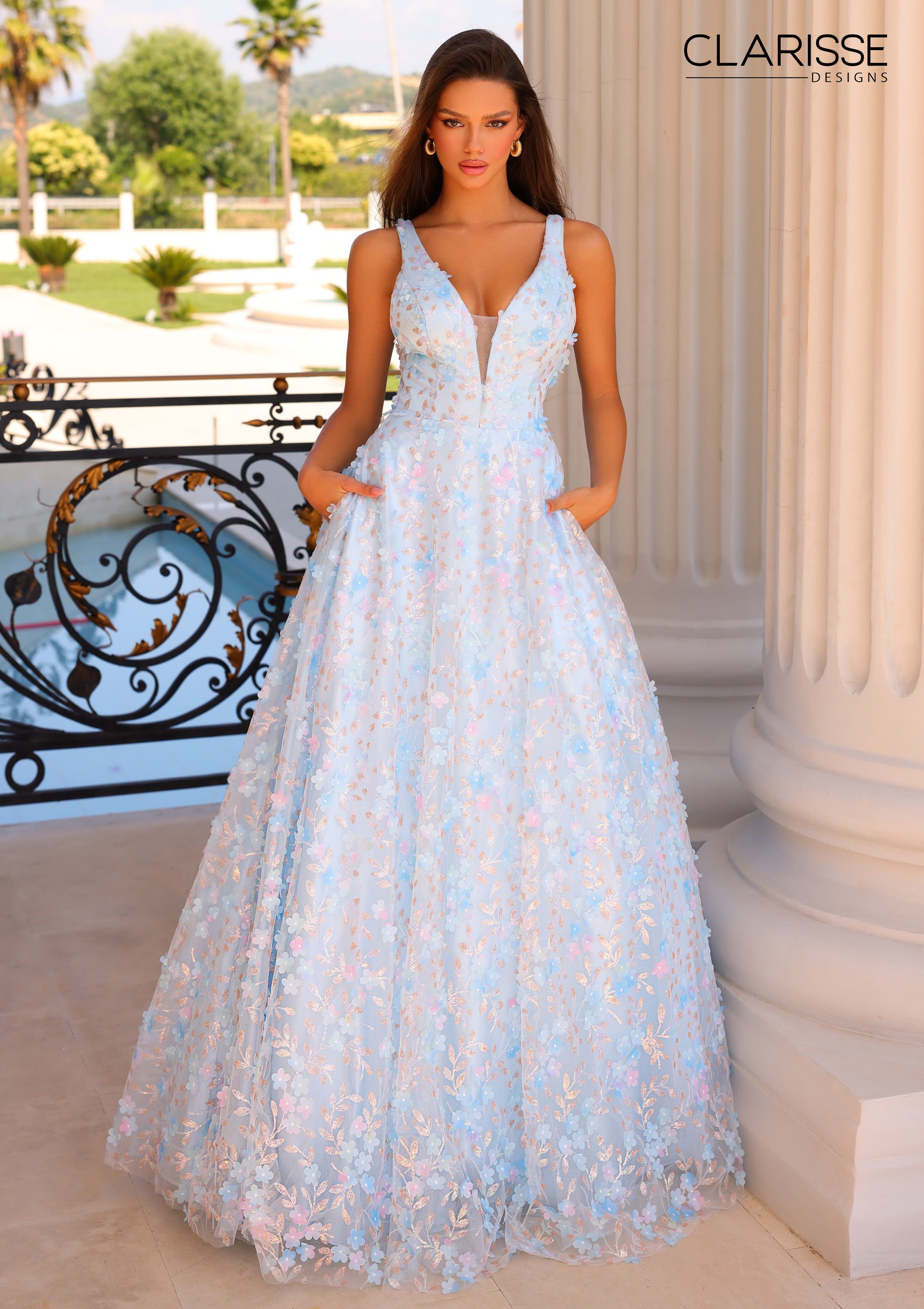 Stunning light blue ballgown with multi-color flower appliques.